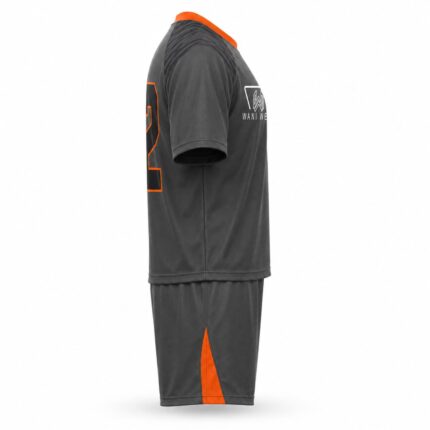 Custom lacrosse uniform side view — grey and orange sublimated jersey with shorts, Wani Wear