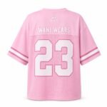 Back of pink oversized football jersey showing sublimated team name and number 23