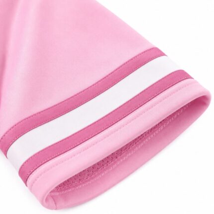 Close-up of pink mesh football jersey hem showing contrast sleeve stripe trim