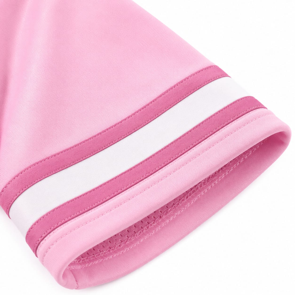 Close-up of pink mesh football jersey hem showing contrast sleeve stripe trim