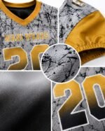 Close-up detail of breathable poly-spandex mesh fabric, reinforced stitching, and vibrant sublimation print on the football jersey.