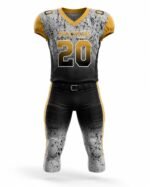 Custom American football uniform front view featuring black and grey sublimated jersey with gold accents and matching padded pants by Wani Wears.