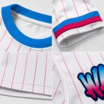Baseball jersey fabric and stitching detail — ribbed collar, striped cuff, hemline, and logo close-up