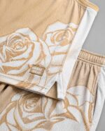Custom gold rose basketball uniform fabric and stitching close-up