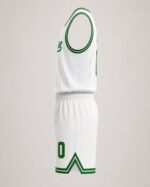 Side view of white and green basketball jersey and shorts