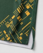 Basketball shorts sublimated fabric hem close up green gold