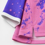 Purple and pink women’s volleyball jersey neckline close-up