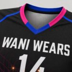 Close-up of customized women’s volleyball jersey sleeve, V-neck and reinforced stitching