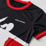 Close-up of custom black women’s volleyball jersey with red collar and reinforced stitching