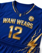 Royal blue and gold women's volleyball jersey and shorts set laid flat