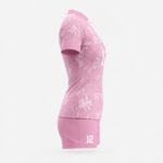 Side view of pink women’s volleyball jersey and matching athletic shorts