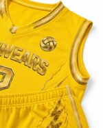 Custom yellow volleyball jersey and shorts showing gold trim and lightning graphics