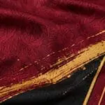 Sublimated basketball jersey breathable mesh fabric with burgundy black and gold graphics