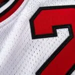 Close-up of custom basketball jersey mesh fabric and stitched red number