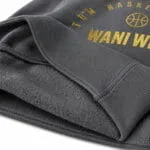 Close-up of soft brushed fleece fabric and ribbed cuff on a custom basketball hoodie