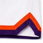 Reinforced side-split stitching on custom mesh basketball shorts