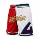 Custom split-color basketball shorts with gold embroidered logo and purple appliqué