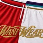 Gold embroidery close-up on custom red and white basketball shorts