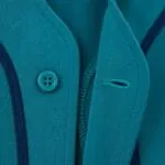 Reinforced buttonhole stitching on custom teal full button baseball jersey