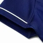 Reinforced sleeve stitching and white piping on custom navy baseball jersey