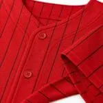 Custom baseball jersey collar, button placket, sleeve hem and reinforced stitching close-up