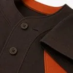 Black and orange sublimated baseball jersey fabric with custom cityscape design