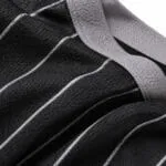 Breathable black pinstripe fabric close-up on custom baseball jersey
