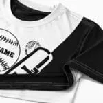 Black and white custom baseball jersey stitching close-up showing crew neck, shoulder seam, sleeve hem and bottom hem