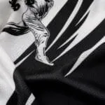 Custom baseball T-shirt fabric close-up showing breathable mesh texture and detailed black-and-white player print