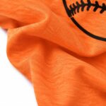 ustom baseball T-shirt jersey fabric close-up showing soft texture and high-quality printed baseball graphic