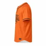 Custom orange two-button baseball jersey side view with black sleeve trim and curved hem