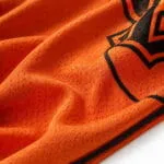 Orange baseball jersey breathable polyester mesh fabric and sublimation print close-up