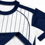 Reinforced collar, shoulder, sleeve and hem stitching on a custom pinstripe baseball T shirt jersey