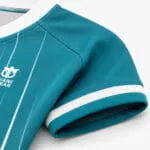 Breathable sublimated fabric on teal baseball jersey