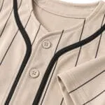 Reinforced stitching and button details on baseball uniform