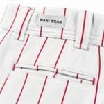 Reinforced stitching and WANI WEAR label close-up
