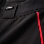 Red piping and reinforced stitching on baseball pants
