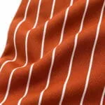 Orange pinstripe baseball knickers fabric close-up