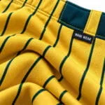Yellow performance fabric with green baseball pinstripes