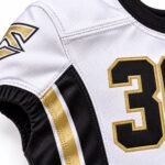 Reinforced stitching and tackle-twill football jersey number