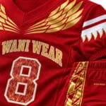 Custom American football jersey and pants with red and gold wing design