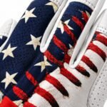 Close-up of patriotic batting gloves showing red lace print over faded flag stripes