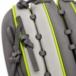 Close-up of custom baseball glove with two-tone grey leather, neon lime welting, and grey leather lacing