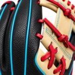 Close-up of custom baseball glove with black leather, cyan welting, and scarlet lacing
