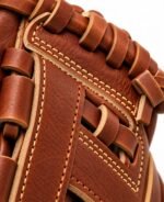 Close-up of outfield baseball gloves rawhide lacing and contrast web stitching
