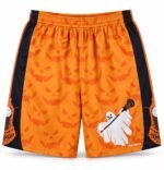 Customized lacrosse shorts front view with orange jack-o'-lantern print, ghost lacrosse graphic, and black side panels