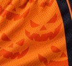 Close-up of breathable mesh fabric on customized lacrosse shorts with sublimated pumpkin print