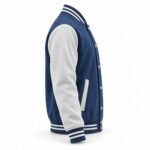 Navy varsity jacket side profile with white sleeve, snap-button front, contrast welt pocket and striped rib-knit cuff and waistband