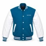 Front view of a blue custom varsity jacket with white contrast sleeves, white snap buttons, blue and white striped rib collar, cuffs and waistband, and WANI WEAR text on the chest