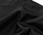 Close-up of elastic cuff on black nylon custom printed coach jacket